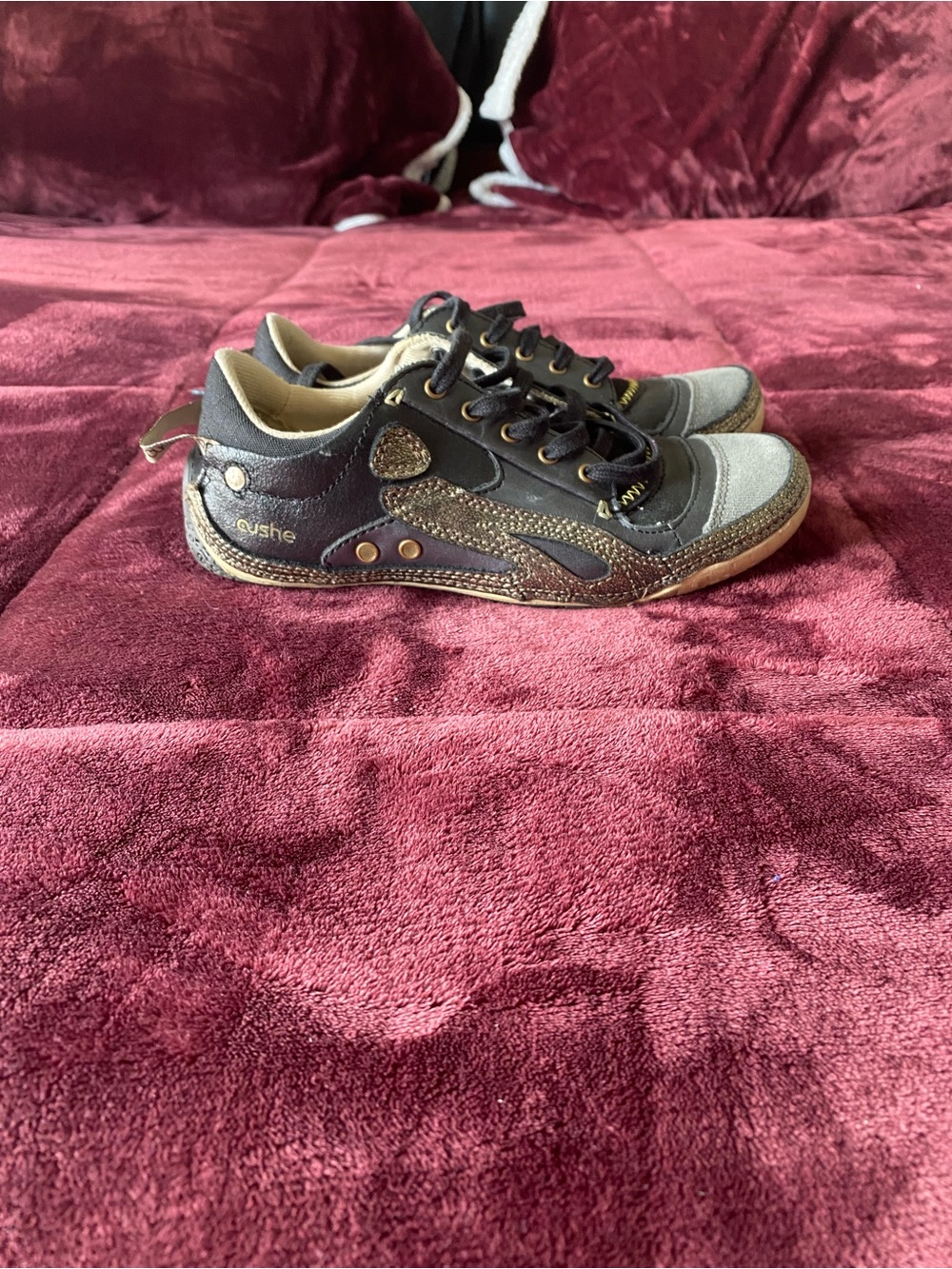 cushe Black and Gray Low-Top Sneakers with Gold Accents